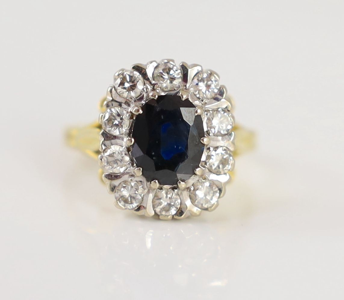 A 1970's 18ct gold, sapphire and diamond set rounded rectangular cluster ring